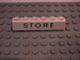 Part No: 3009px55 Name: Brick 1 x 6 with Black 'STORE' Pattern Part No: 3009px55 Name: Brick 1 x 6 with Black 'STORE' Pattern