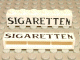 Part No: crssprt02pb07 Name: Brick 1 x 6 without Bottom Tubes with Cross Side Supports with Black 'SIGARETTEN' Pattern Part No: crssprt02pb07 Name: Brick 1 x 6 without Bottom Tubes with Cross Side Supports with Black 'SIGARETTEN' Pattern