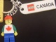 Gear No: 853307  Name: Minifigure Male with Maple Leaf Key Chain with Lego Logo Tile, Modified 3 x 2 Curved and Tile 2 x 4 with 'CANADA' Pattern