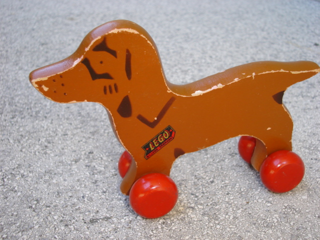 Pull along toy outlet dog on wheels