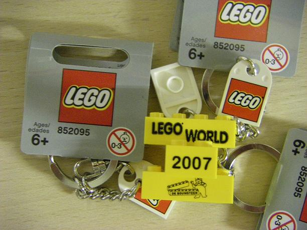 2 x 4 Brick - Yellow Key Chain with Lego Logo Tile, Modified 3 x 2 Curved with Hole - Lego World 2007 De Bouwsteen Pattern