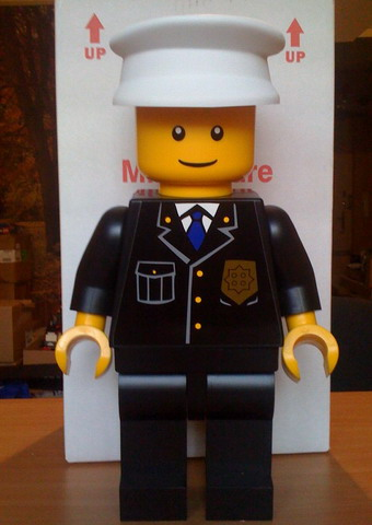 Display Figure 7in x 11in x 19in (black jacket, black pants, white hat, Police)