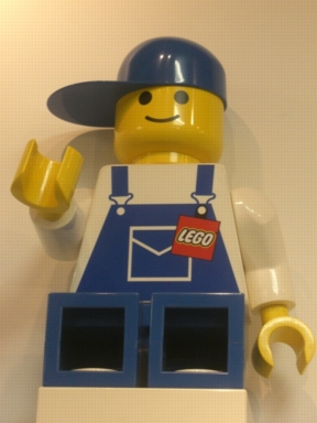 Display Figure 7in x 11in x 19in (blue overalls, blue pants, blue cap)