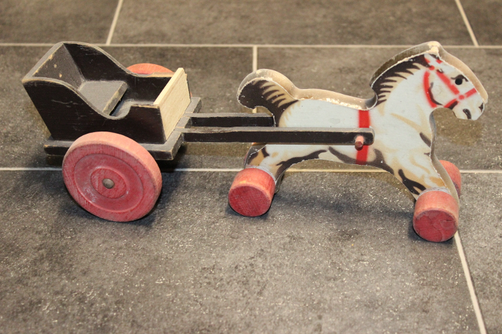 Wooden Horse and Black Carriage