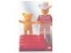Gear No: lap02-027  Name: Postcard - Lego Art Project 2002 - 027 - Minifigure with Yellow Bear Behind Red Brick