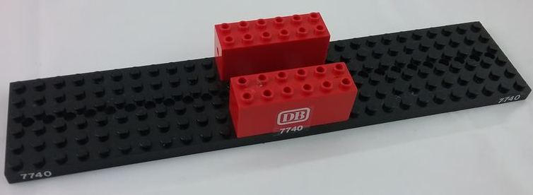 Stickered Assembly 28 x 6 x 2 2/3 with White '7740' and 'DB' Pattern on Both Sides (Stickers) - Set 7740 - 1 Train Base 6 x 28 with 11 Round Holes Each End, 2 Brick, Modified 2 x 6 x 2 Weight - Bottom Openings, Center Seam on Ends