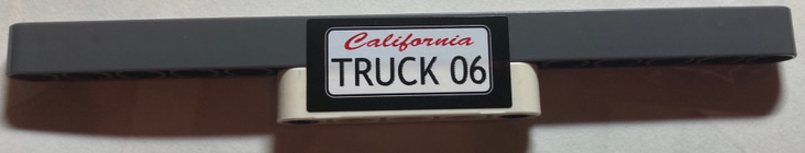 Stickered Assembly 15 x 1 x 2 with Red 'California' and Black 'TRUCK 06' License Plate Pattern (Sticker) - Set 8682 - 1 Technic, Liftarm Thick 1 x 5, 1 Technic, Liftarm Thick 1 x 15, 2 Technic, Pin with Short Friction Ridges