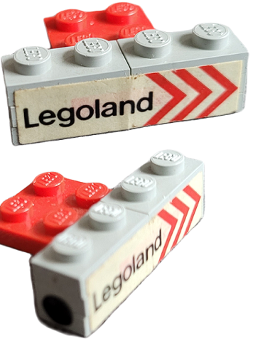 Stickered Assembly 4 x 3 x 1 with 'Legoland' and Red Chevrons on Side and Black Dot Pattern on Both Ends Model Right Side (Stickers) - Set 687 - 2 Plate 1 x 1, 4 Plate 1 x 2, 1 Plate 2 x 3