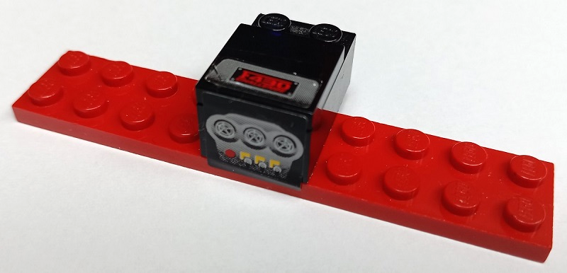 Stickered Assembly 10 x 3 x 1 2/3 with Ferrari Centre Console with Red 'F430 CHALLENGE', Yellow Buttons, Switches and Air Vents Pattern (Stickers) - Set 8143 - 1 Plate 2 x 10, 1 Brick 2 x 3, 1 Tile 2 x 2