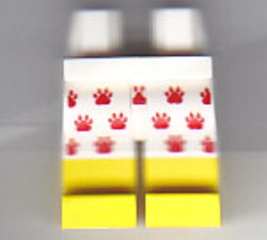 Hips and Legs with Red Paw Prints on White Shorts and Yellow Lower Legs Pattern