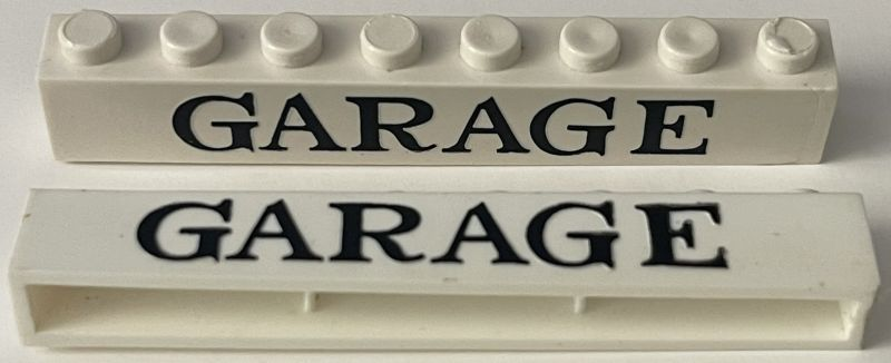 Brick 1 x 8 without Bottom Tubes with Cross Side Supports with Black 'GARAGE' Serif Pattern