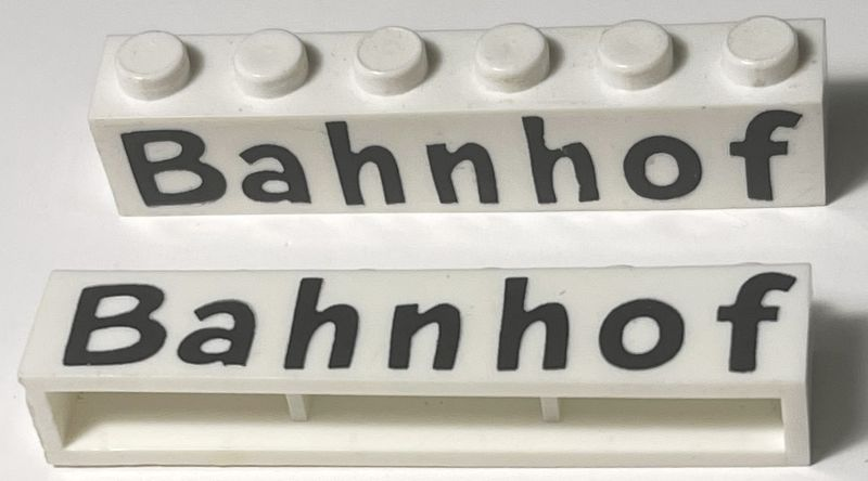 Brick 1 x 6 without Bottom Tubes with Cross Side Supports with Black 'Bahnhof' Comic Sans Pattern