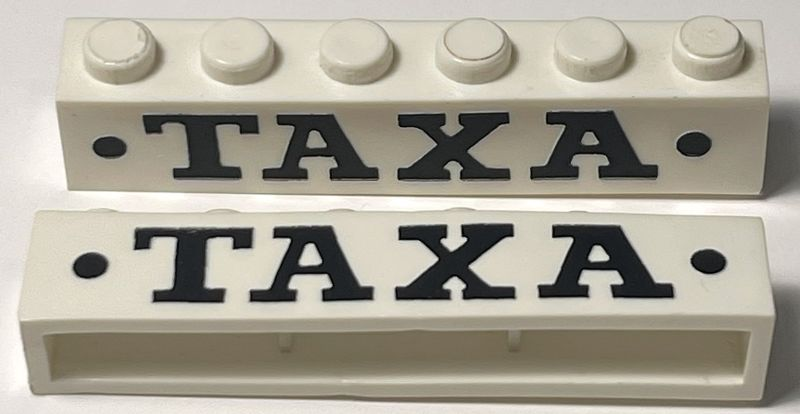 Brick 1 x 6 without Bottom Tubes with Cross Side Supports with Black 'TAXA' Serif Bold Large and Dots Pattern