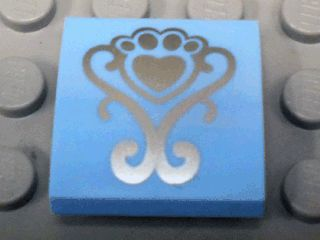 Slope, Curved 2 x 2 x 2/3 with Silver Fancy Scroll and Heart Shaped Paw Pattern