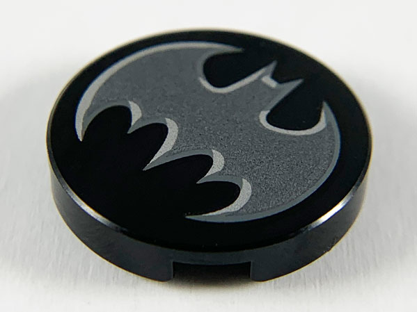 Tile, Round 2 x 2 with Bottom Stud Holder with Dark Silver Bat with Silver Edges Batman Logo Pattern