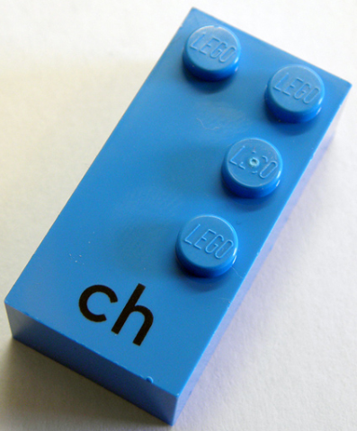 Brick, Braille 2 x 4 with 4 Studs with Black Lowercase Letters ch Pattern (dots-1456 ⠹) (German)