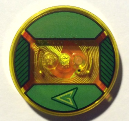 Dimensions Toy Tag 4 x 4 x 2/3 with 2 Studs and Trans-Orange Bottom with Stylized Lime Capital Letter G in Black Arrowhead on Green Background Pattern (Green Arrow)