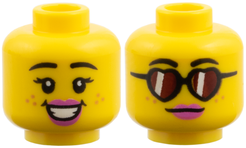 Yellow dual-sided female head with freckles, dark pink lips, and a smile, with reddish brown heart-shaped glasses on the alternate side.