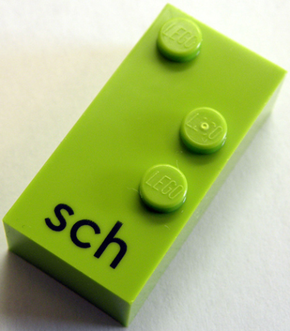 Brick, Braille 2 x 4 with 3 Studs with Black Lowercase Letters sch Pattern (dots-156 ⠱) (German)