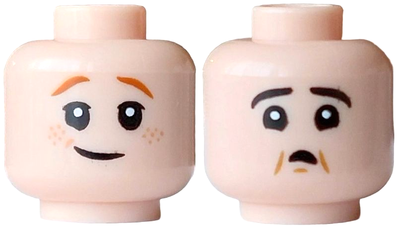 Light nougat dual-sided head with orange eyebrows and freckles; one side has a lopsided grin, the other a scared open mouth with cheek lines.