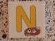 Part No: 3068pb0723  Name: Tile 2 x 2 with Letter N Yellow with Nest Pattern