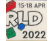 Part No: 3068pb2143  Name: Tile 2 x 2 with LEGO World Logo Right Half, '15-18 APR', 'RLD' and '2022' Pattern
