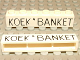 Part No: crssprt02pb13  Name: Brick 1 x 6 without Bottom Tubes with Cross Side Supports with Black 'KOEK ' BANKET' Thin Pattern