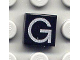 Part No: 3070pb015  Name: Tile 1 x 1 with Silver Capital Letter G Pattern