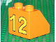 Part No: 6474pb22  Name: Duplo, Brick 2 x 2 x 1 1/2 Slope 45 with Yellow '12' Pattern