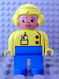 Duplo Figure, Female, Blue Legs, Yellow Top with Radio in Pocket, Yellow Aviator Helmet, Eyelashes