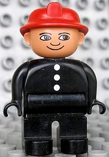 Duplo Figure, Male Fireman, Black Legs, Black Top with 3 White Buttons, Red Fire Helmet