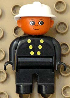 Duplo Figure, Male Fireman, Black Legs, Black Top with 6 Yellow Buttons, White Fire Helmet, Brown Head