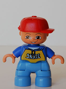 Duplo Figure Lego Ville, Child Boy, Medium Blue Legs, Blue Top with &#39;SKATE&#39; Pattern, Red Cap, Freckles