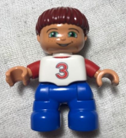 Duplo Figure Lego Ville, Child Boy, Blue Legs, White Top with Red '3' Pattern, Dark Red Hair