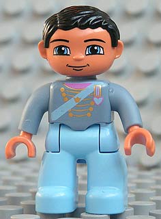 Duplo Figure Lego Ville, Male, Light Blue Legs, Sand Blue Top with Strap, Gold Crown and Medium Blue Heart, Black Hair