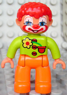Duplo Figure Lego Ville, Male Clown, Orange Legs, Lime Top with Three Buttons and Flower, Red Hair, Blue Eyes