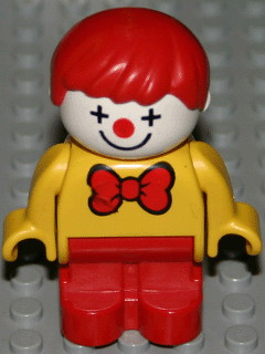 Duplo Figure, Child Type 1 Boy, Red Legs, Yellow Top With Red Bow Tie, Red Hair (Clown)