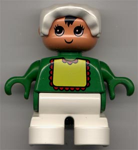 Duplo Figure, Child Type 2 Baby, White Legs, Green Top with Yellow Bib with Red Lace, White Bonnet