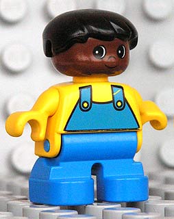 Duplo Figure, Child Type 2 Boy, Blue Legs, Yellow Top with Blue Overalls, Black Hair, Brown Head