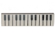 Lego part: Tile 1 x 4 with Black and White Piano Keys Pattern