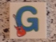 Lot ID: 408310537  Part No: 3068pb0716  Name: Tile 2 x 2 with Letter G Blue with Guitar Pattern