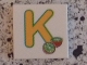 Lot ID: 180972138  Part No: 3068pb0720  Name: Tile 2 x 2 with Letter K Yellow with Kiwi Pattern