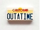 Part No: 3069pb0288  Name: Tile 1 x 2 with Red 'CALIFORNIA' and Blue 'OUTATIME' Pattern
