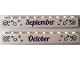 Part No: 6111pb019  Name: Brick 1 x 10 with Dark Purple 'September' and 'October' Pattern on Opposite Sides
