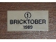 Part No: 87079pb0010  Name: Tile 2 x 4 with Black '1' in Circle and 'BRICKTOBER 1989' Pattern
