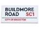 Part No: 87079pb1364  Name: Tile 2 x 4 with Black 'BUILDMORE ROAD' and Red 'SC1' and 'CITY OF BRICKSTON' Pattern (Sticker) - Set 21347