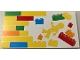 Part No: 90498pb48L  Name: Tile 8 x 16 with Bottom Tubes, Textured Surface with Yellow, Orange, Dark Azure, Red and Bright Green Bricks, Brick Wall and Minifigure Pattern Model Left Side