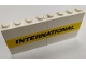Part No: BA098pb02  Name: Stickered Assembly 8 x 1 x 3 with Black 'INTERNATIONAL' on Yellow Stripe Pattern (Sticker) - Set 6367 - 2 Panel 1 x 4 x 3 - Solid Studs