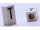 Part No: bb0695pb38  Name: Tile, Modified 1 x 2 x 5/6 Stud Hole in End with Black Capital Letter T Pattern