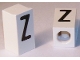 Part No: bb0695pb44  Name: Tile, Modified 1 x 2 x 5/6 Stud Hole in End with Black Capital Letter Z Pattern